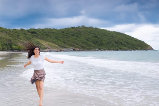 Beautiful Asian woman vacation on beach of Thailand.