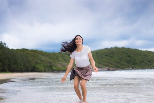 Beautiful Asian woman vacation on beach of Thailand.