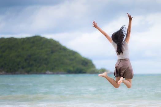 Beautiful Asian woman vacation on beach of Thailand.