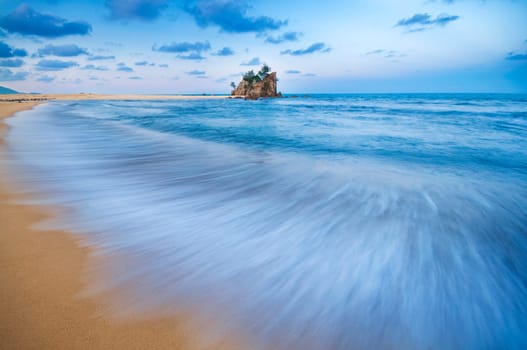 Long exposure slow shutter of waves during sunset at Kemasik beach, Terengganu, Malaysia