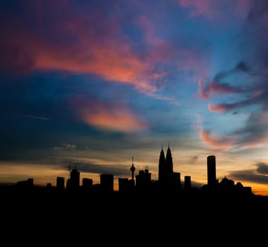 Silhouette Kuala Lumpur city skyline in twilight.