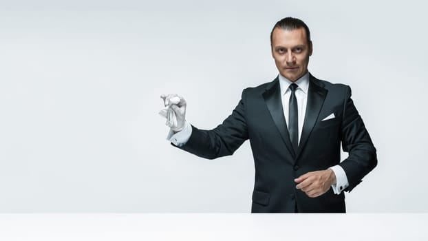 At Your service, well dressed man waiting for orders isolated on white background with copy space at studio