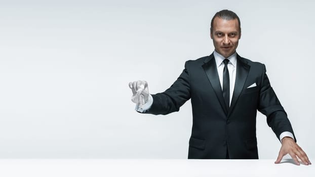 At Your service, well dressed man waiting for orders isolated on white background with copy space at studio