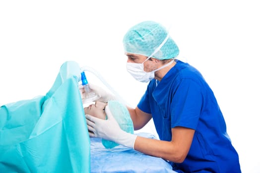 young anesthetist with oxygen mask and patient in front of white background