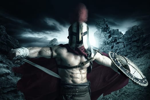 Ancient warrior or Gladiator posing outdoors with helmet
