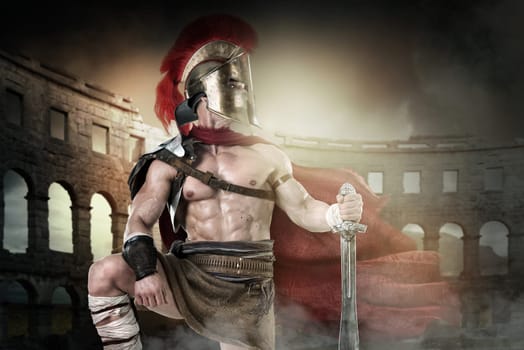 Ancient warrior or Gladiator posing in the arena
