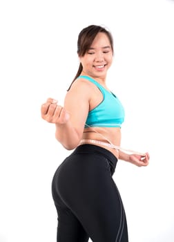 chubby  woman measuring her waistline fat tummy