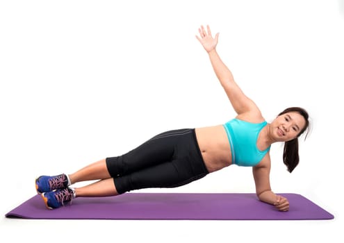 chubby woman doing fitness on white background