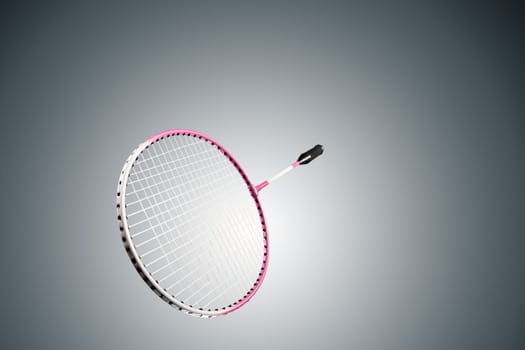 Color photo of one racket for badminton isolated on gray