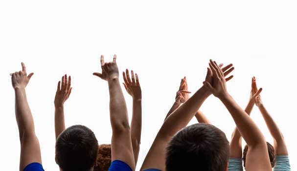 The hands of fans during a concert. Studio shot on white background