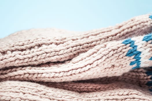 The arge folds on the warm knit light scarf