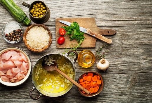 Ingredients with chicken and vegetables for cooking risotto