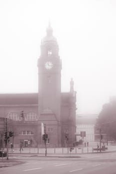 Wiesbaden,Germany - October 15,2017: The historic building of Wiesbaden Central Station with a clock tower in the fog on October 15,2017 in Wiesbaden.