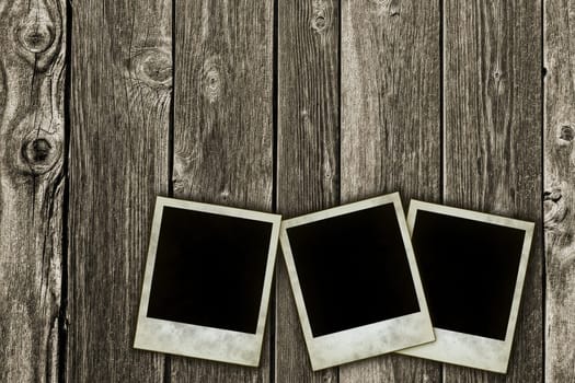 instant pictures on wooden background