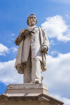 VERONA, ITALY - May 25, 2017: Monument of Aleardo Aleardi, poet, politician and patriot of the italian Risorgimento, belonging to the current of romanticism, a movement in the arts and literature that originated in the late 18th century, emphasizing inspiration, subjectivity, and the primacy of the individual. The statue was inaugurated in 1883 by Ugo Zannoni.