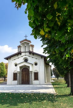 Small church with fall foliage in Autumn