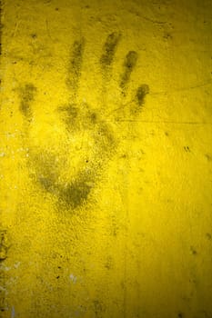 Grungy wall with hand print. It can be used as a backdrop, grungy wallpaper, design t-shirts and more. Fully editable.