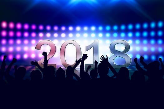 Crowd of people celebrating Happy New Year 2018 against colorful light background