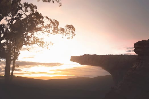 Panoramic view of high cliff with green landscape at sunset background