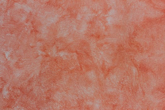 Grunge background - stucco of red color. Closeup textured