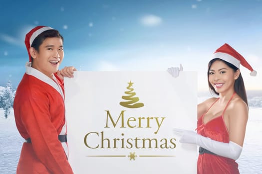 Asian couple wearing santa costume holding banner. Merry christmas concept
