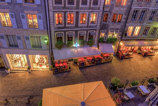 Street and restaurants in old city by night, Geneva, Switzerland