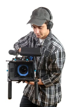 young cameraman with movie camera on the white background