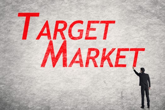 Asian business man write words on wall, Target Market