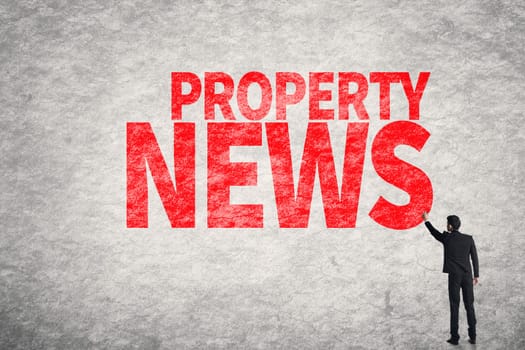 Asian business man write words on wall, Property News