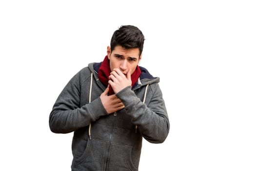 Young man sick with flu or cold, coughing with hand in front of his mouth, isolated on white