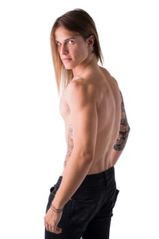 Beautiful young long haired man shirtless, serious, posing isolated on white, profile shot