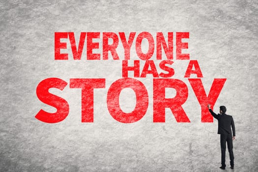 Asian business man write words on wall, Everyone Has a Story