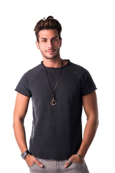 Fit handsome young man standing confident in casual clothes, looking at camera isolated on white