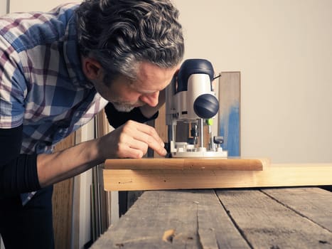 Wood working concept image with an upper mill on a rustic workbench