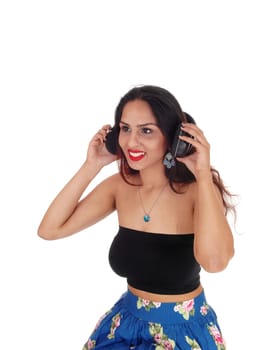 A beautiful happy woman with her headphone listening to music,.in an portrait image, isolated for white background.