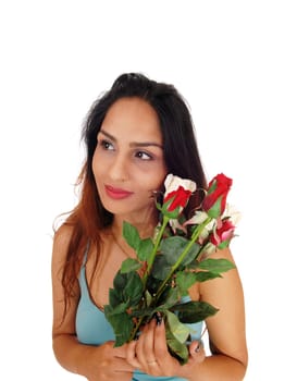 A beautiful woman with brunette hair holding.a bunch of red and white roses, isolated for white background.