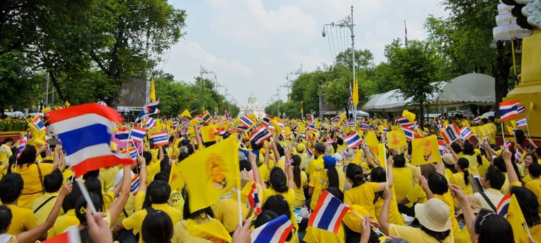 BANGKOK, THAILAND - DECEMBER 5: Thai people gather in the street to pay respect to King Bhumibol on his 85 th birthday celebration on December 5, 2012 in Bangkok, Thailand.
