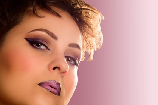 Retro beauty portrait with purple make-up on purple background.