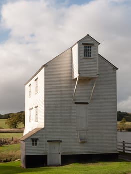 beautiful stunning white wood slat old farm water river mill house close up  essex  england  uk