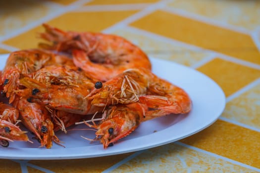 Grilled prawns on plate, delicious prawns on thw table