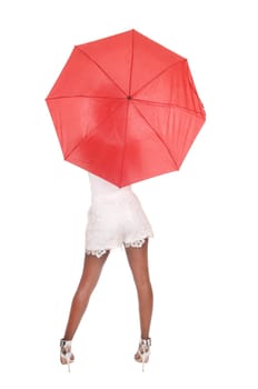 A beautiful African woman in white shorts and high heels standing.with a red umbrella from the back, isolated for white background.