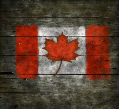 flag of canada with maple leaf on old wooden boards