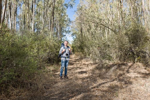 Hiker in the Sardinian Forest with mirrorless camera