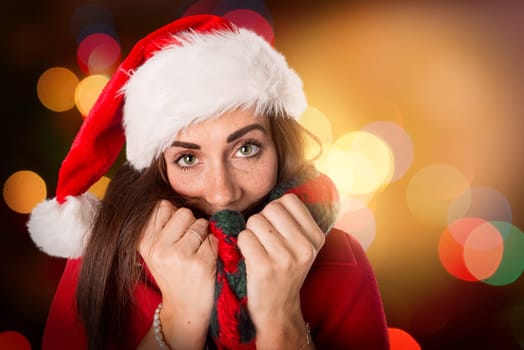 Happy and beautiful girl with freckles in Christmas background
