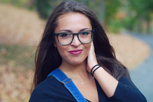 women in a park portrait hand glasses close-up