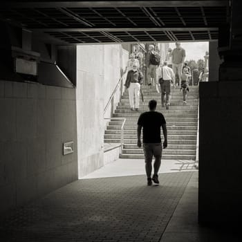Tourists under the Rathausbrücke in the Nikolaiviertel in Berlin-Mitte