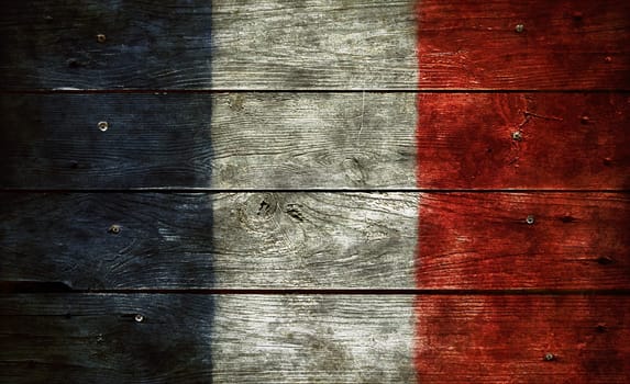flag of france on weathered board wall