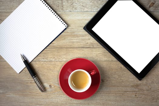 Top view with notepad,tablet,cup and text space