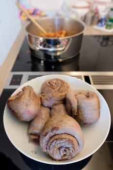 Beefoulade fried on plate and pot with vegetables