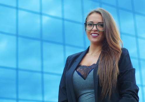 young woman blue skyscraper glasses success attractive office confident person